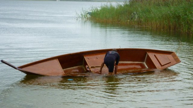 Wooden boat navigation - Photo with a sailing boat, rowing 